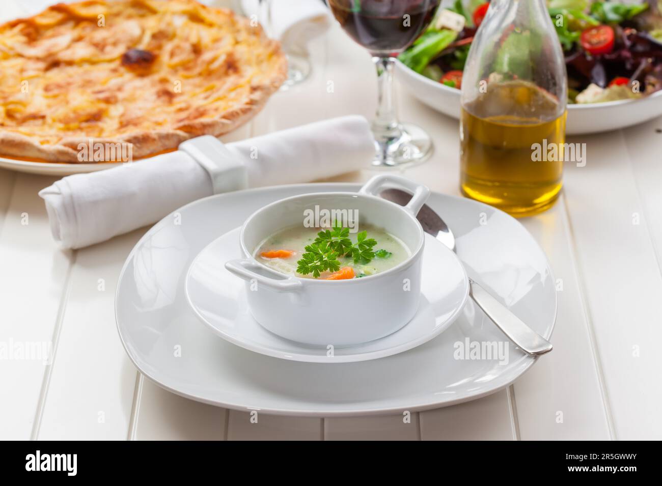 Vegetable soup with bulgur, apple pie and vegetable salad Stock Photo
