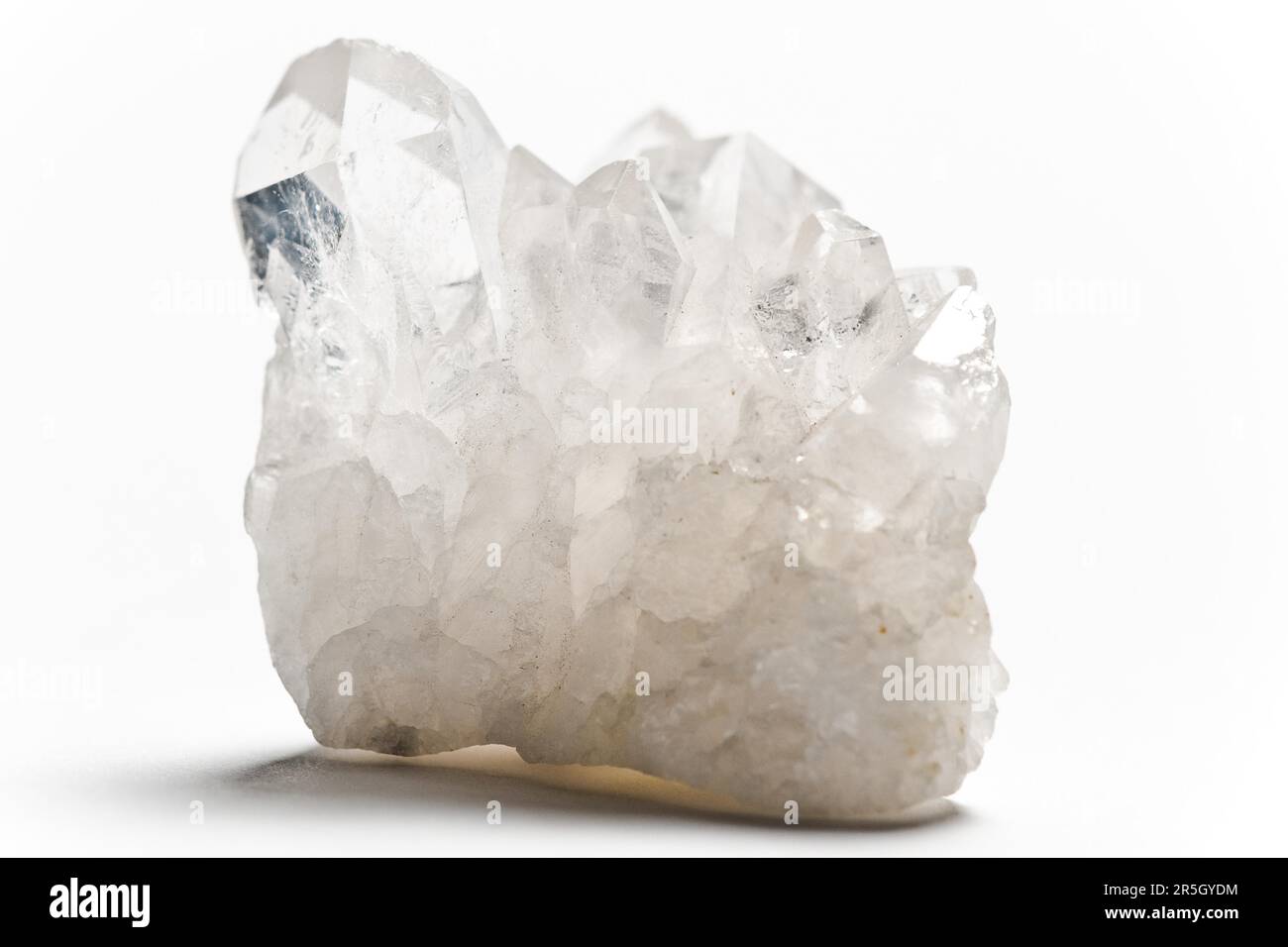 White luminous mountain crystal quartz with white background Stock