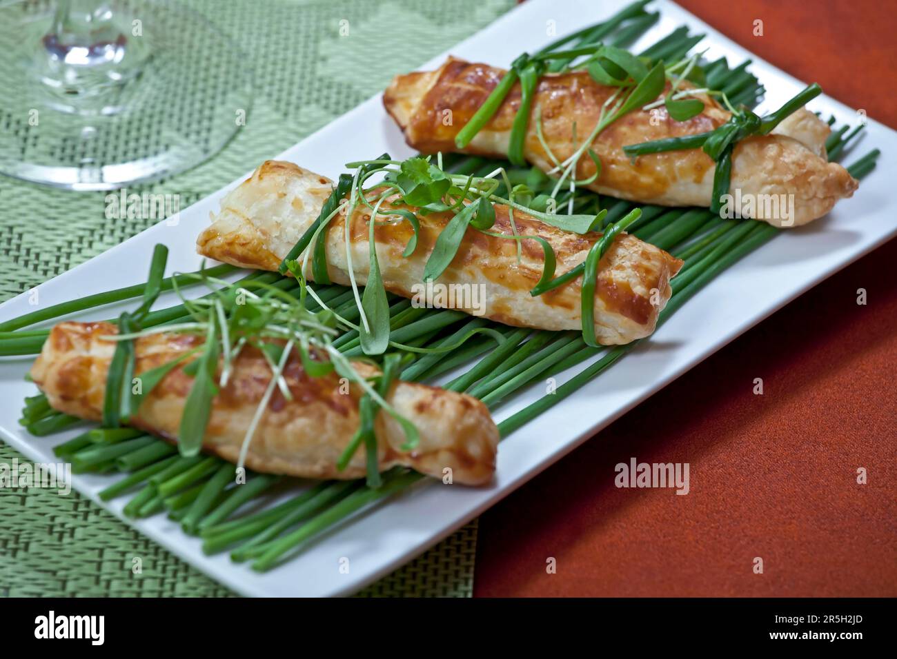 Filled with cheese, with cress and chives, puff pastry, puff pastry pockets, baked Stock Photo