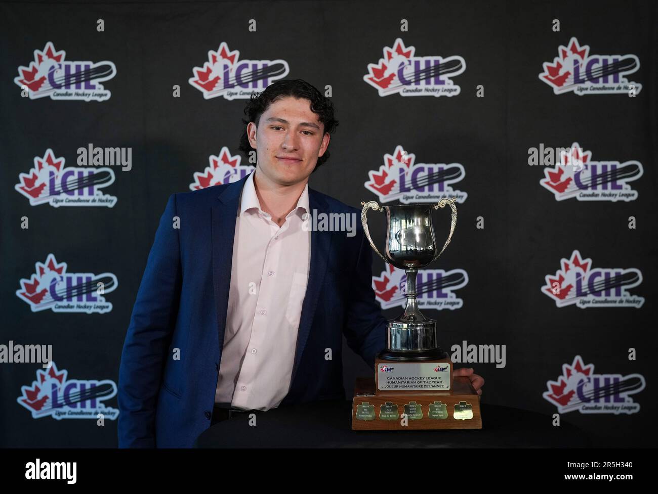 North Bay Battalion center Dalyn Wakely poses with the trophy after