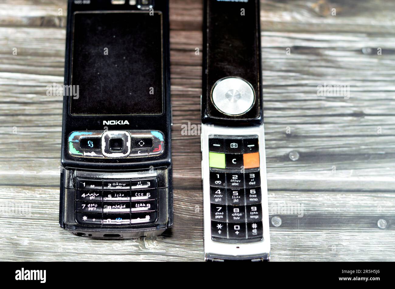 Cairo, Egypt, May 26 2023: Old rotating sliding Samsung mobile cell phone with keypad and buttons that rotates 180 degrees, Samsung and Old sliding No Stock Photo