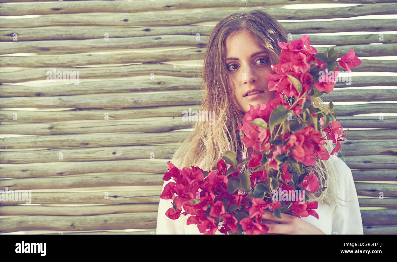 Nothing says femininity quite like flowers. an attractive young woman