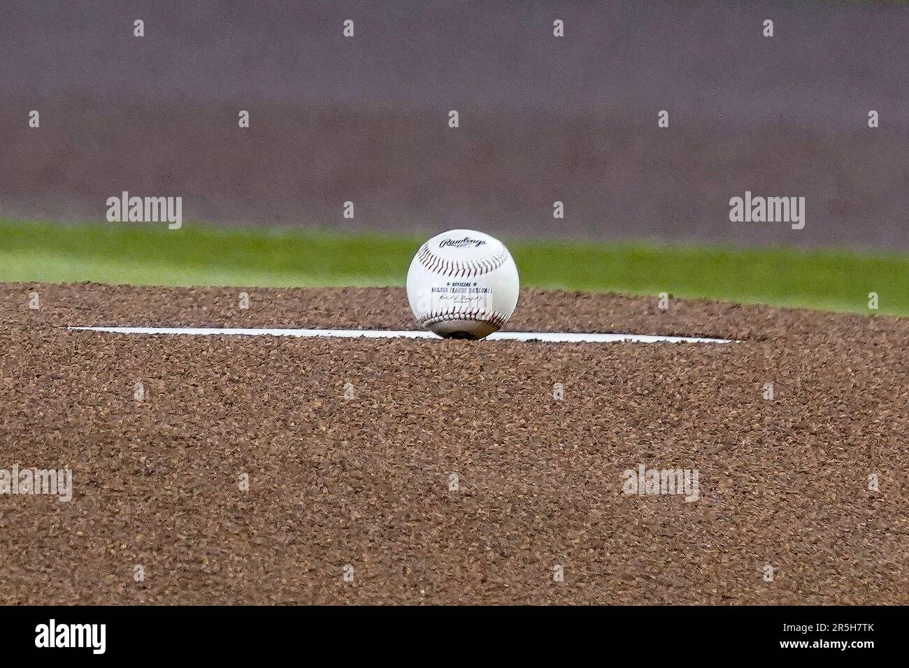 A baseball sits on the pitcher's mound before the Colorado Rockies