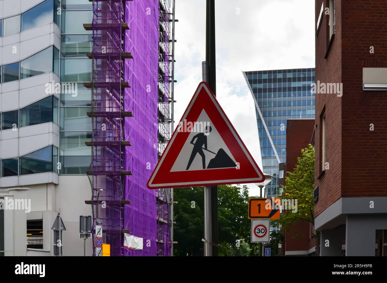 Traffic sign Road Works on city street Stock Photo - Alamy
