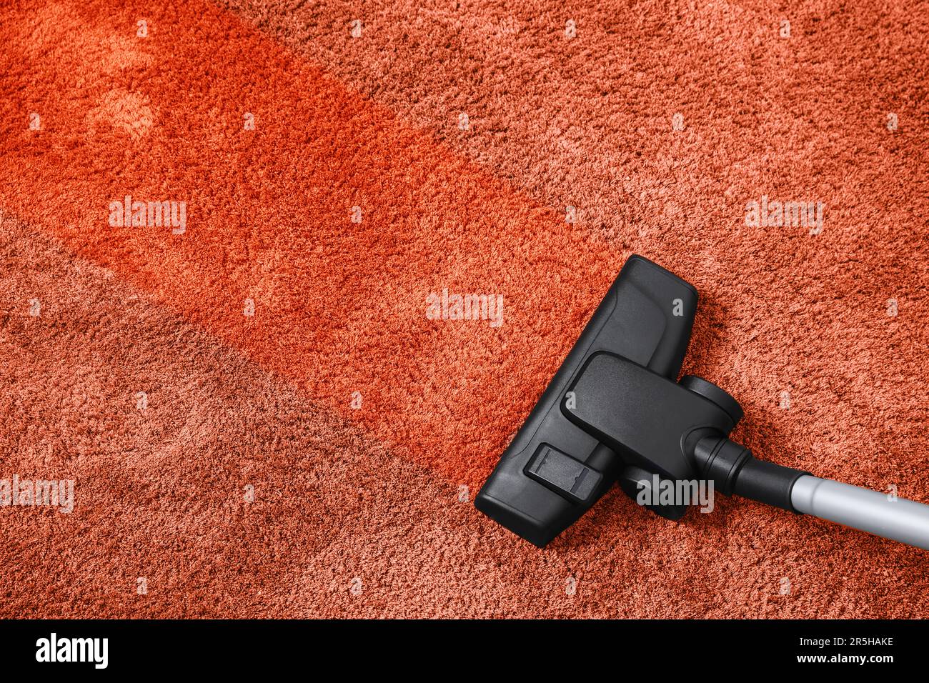 Vacuuming carpet. Clean area after using device, top view Stock Photo