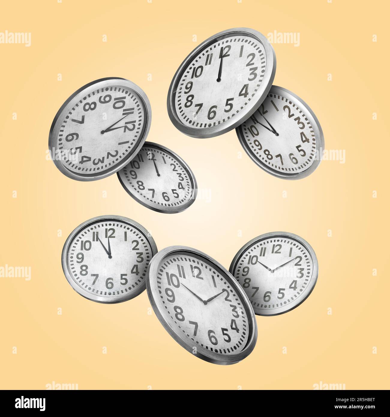 Many clocks falling on pale orange background Stock Photo Alamy