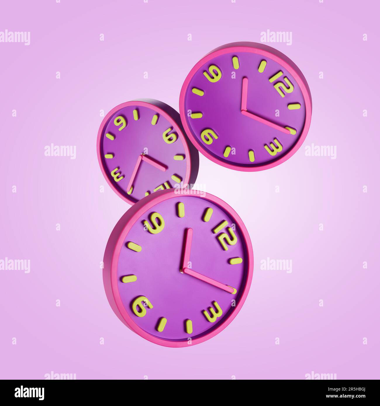 Stylish bright clocks falling on pink background Stock Photo Alamy