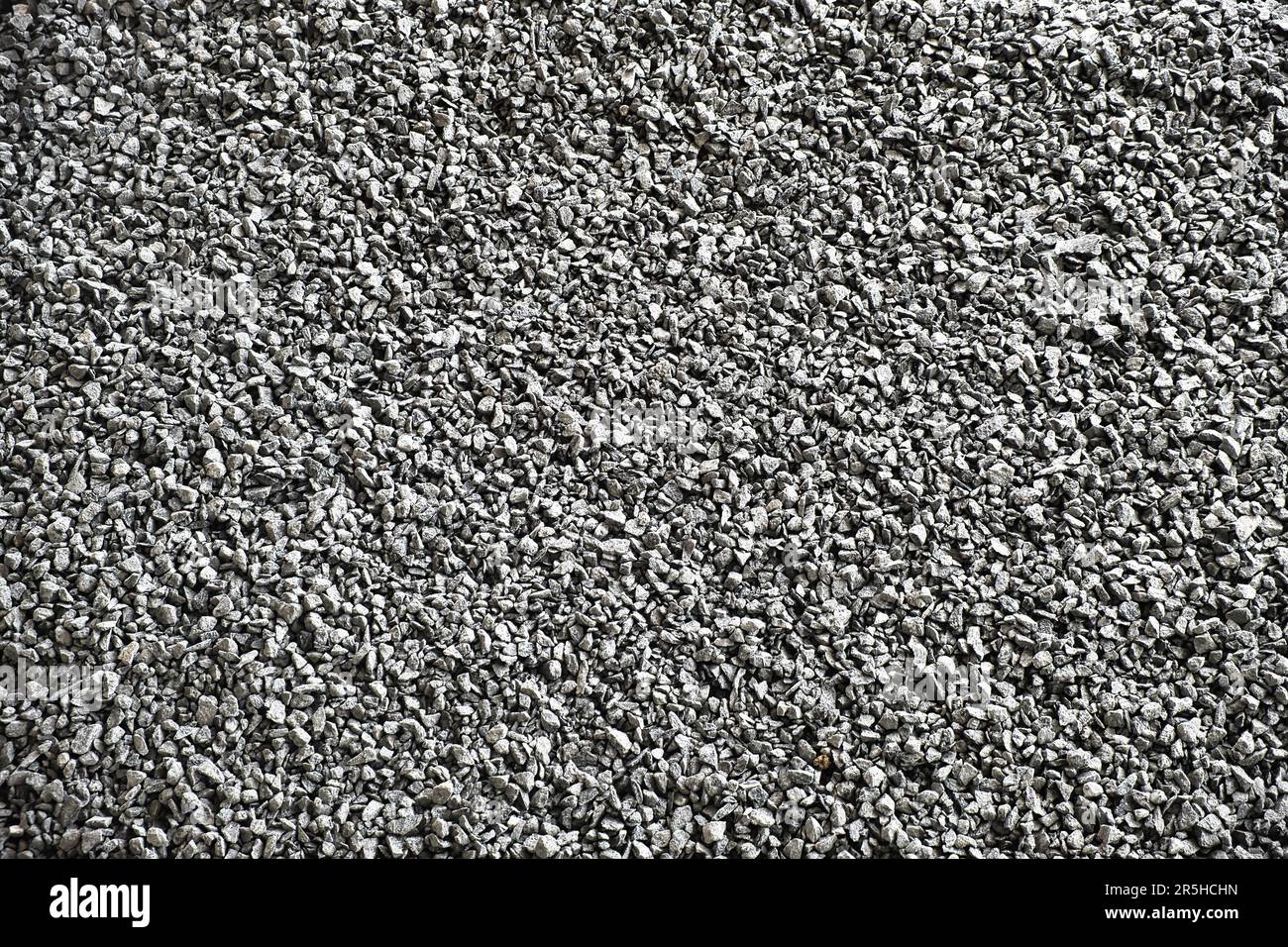 Texture of fine grey gravel used for making concrete Stock Photo