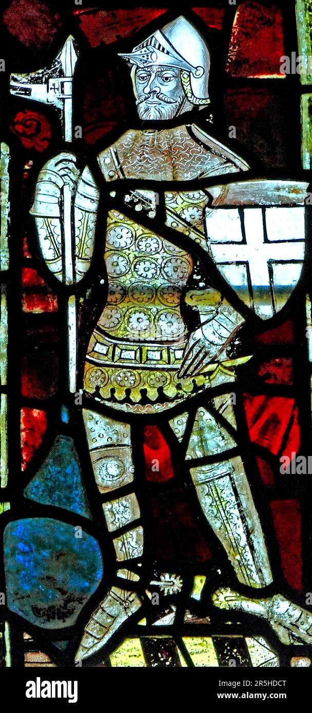 14th century stained glass window, medieval knight in armour, Castle Acre, Norfolk, England, UK Stock Photo