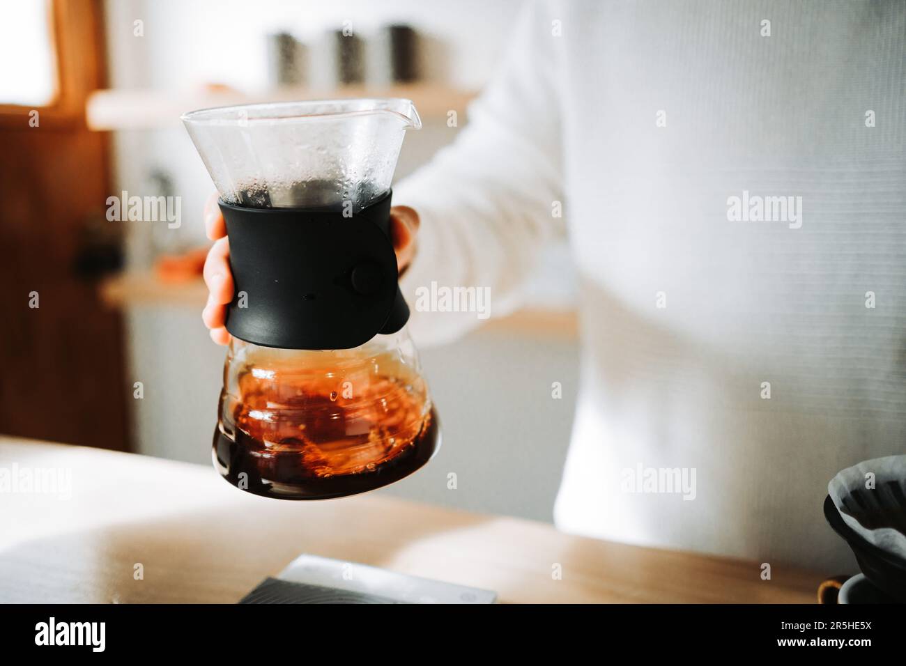 Meticulous Coffee Ritual Masterful Hands Engaged in Precise Chemex