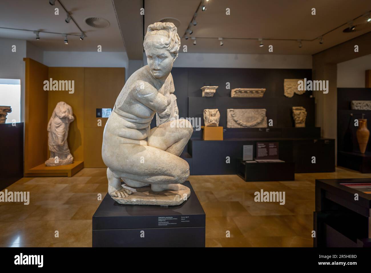 Crouching Aphrodite Sculpture at Archaeological Museum of Cordoba - Cordoba, Andalusia, Spain Stock Photo