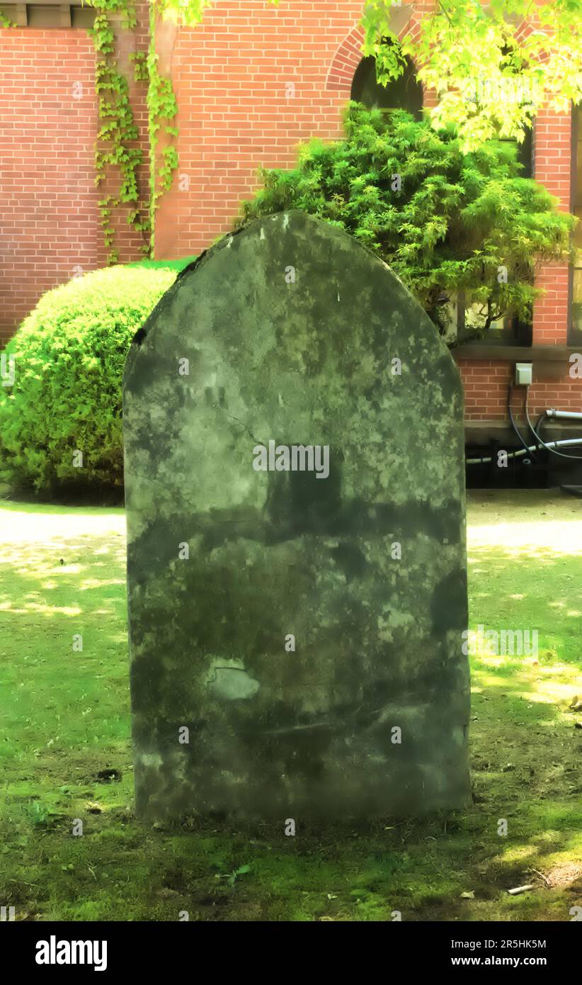 Photo of a very old, vintage, antique tombstone (headstone) at the