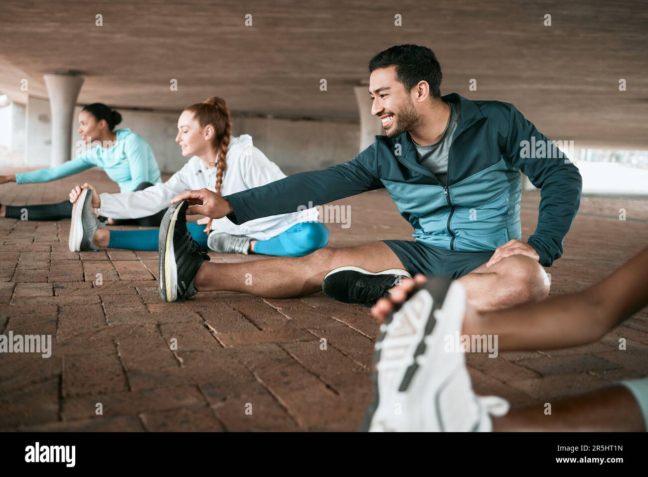 Group, workout and people stretching as a fitness club for sports