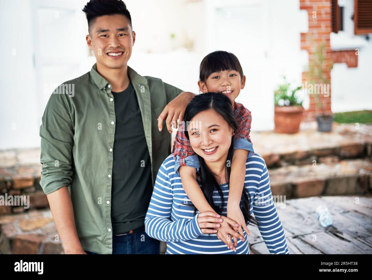 Theyre one happy family. Portrait of a happy family bonding together at home. Stock Photo