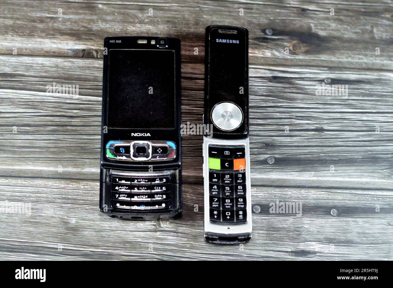 Cairo, Egypt, May 26 2023: Old rotating sliding Samsung mobile cell phone with keypad and buttons that rotates 180 degrees, Samsung and Old sliding No Stock Photo