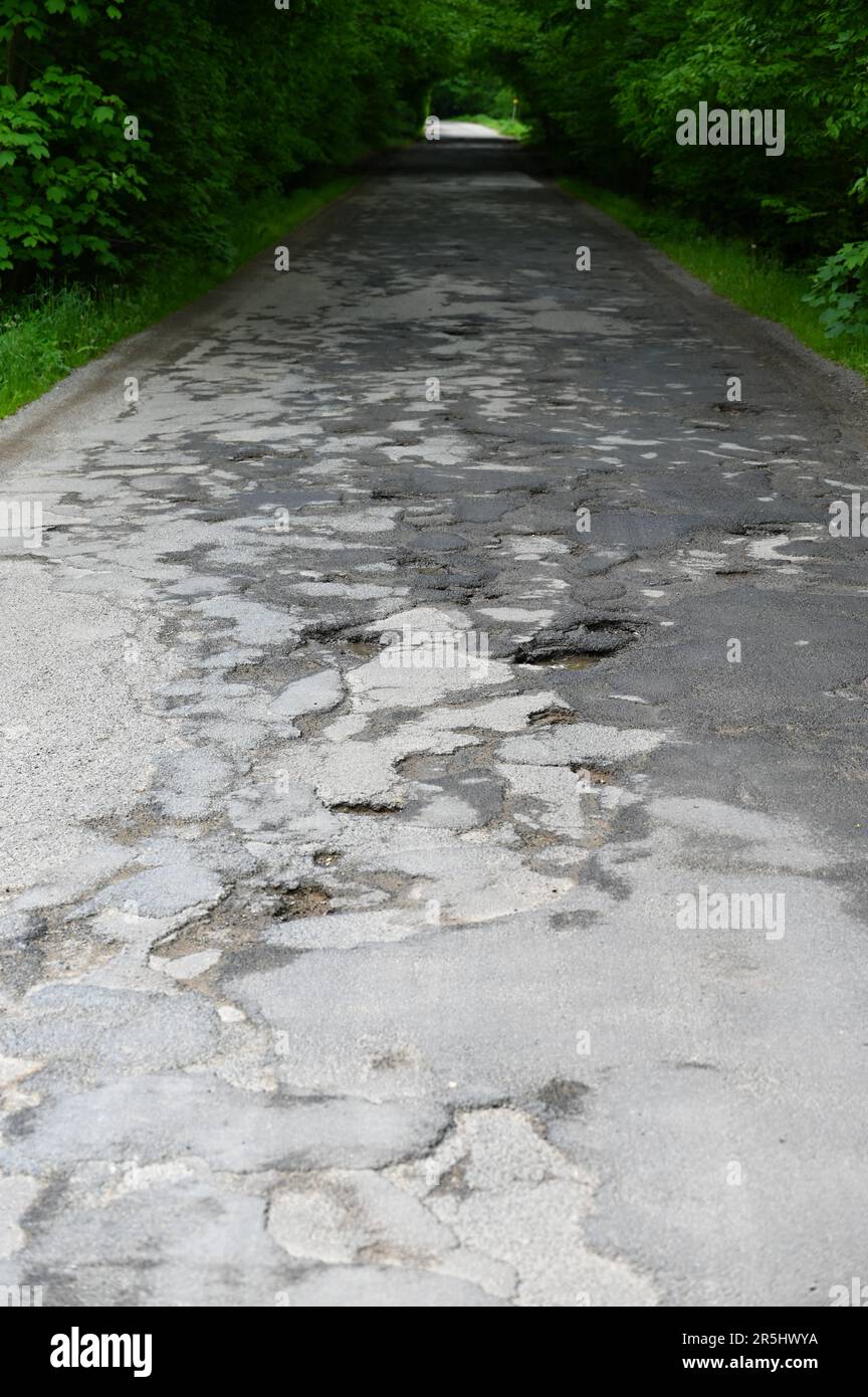 Bad and broken road. A badly repaired road in the Czech Republic. Stock Photo