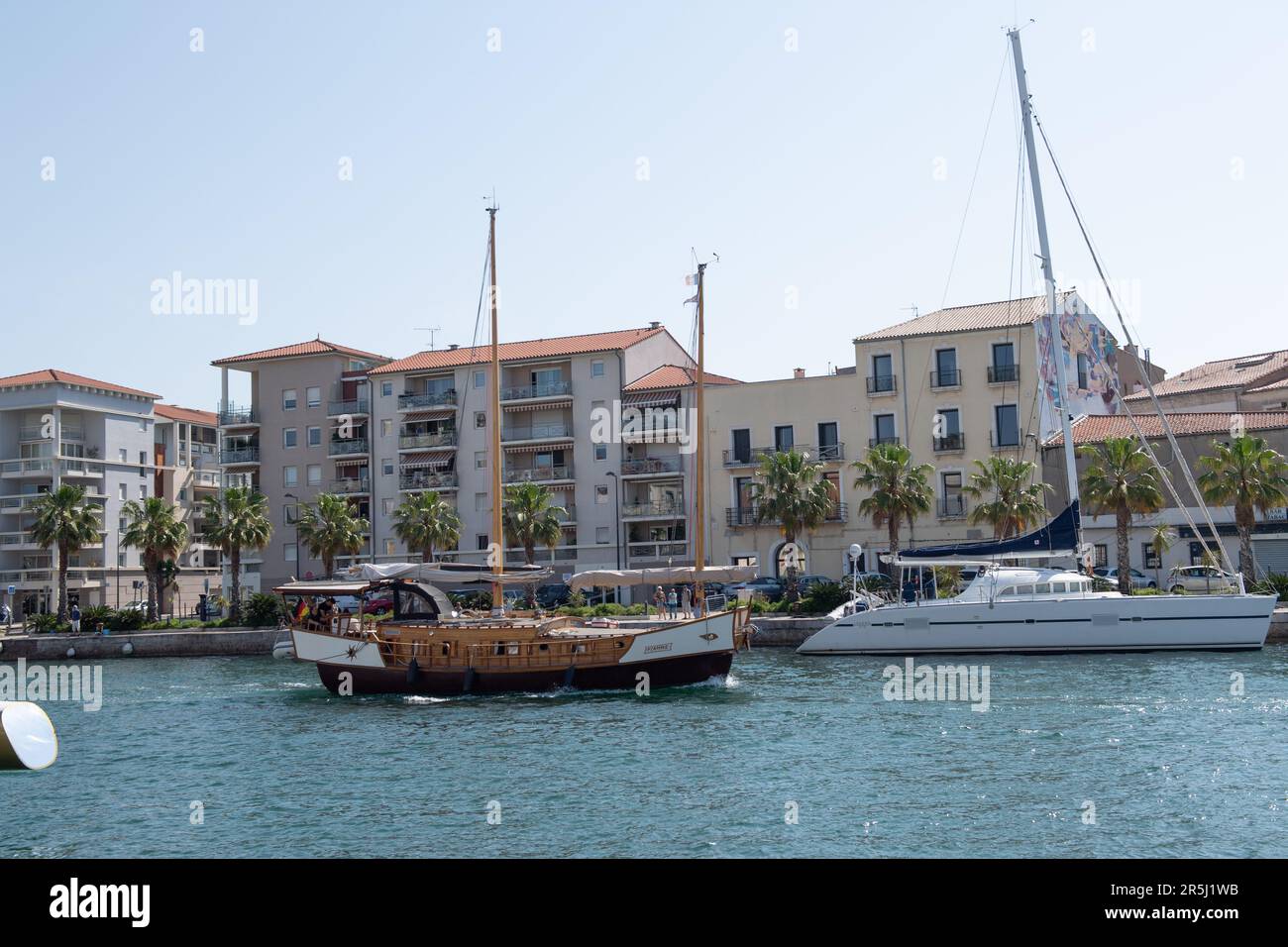 Sete, France. 27th May, 2023. An antique boat sails on the main canal ...