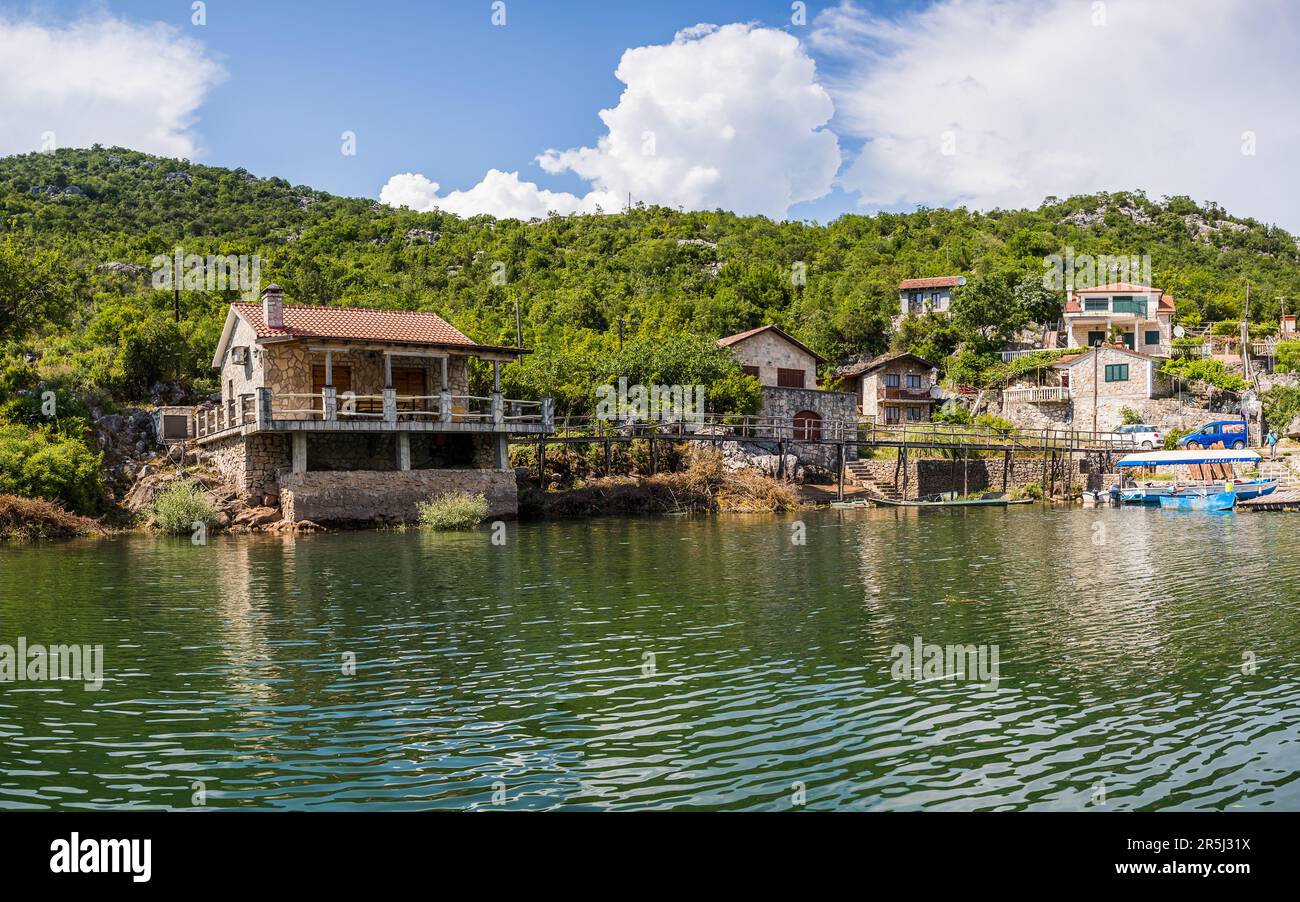 The small village of Karuc seen from the water of Lake Skadar in Montenegro pictured in May 2023. Stock Photo