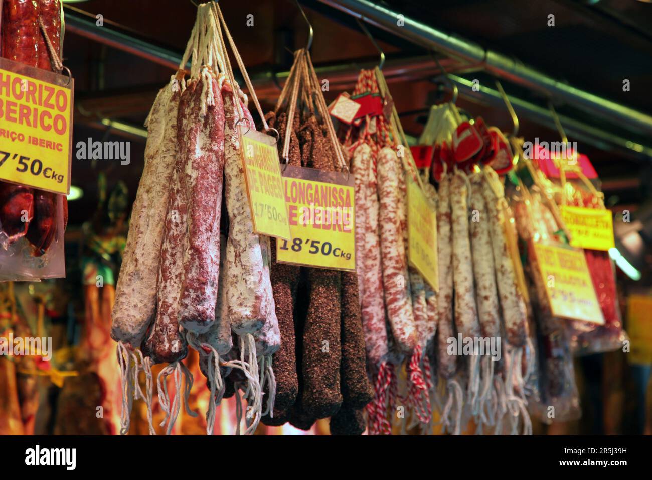 Various types of traditional cured meat sausages such as llonganissa de pebre and chorizo in