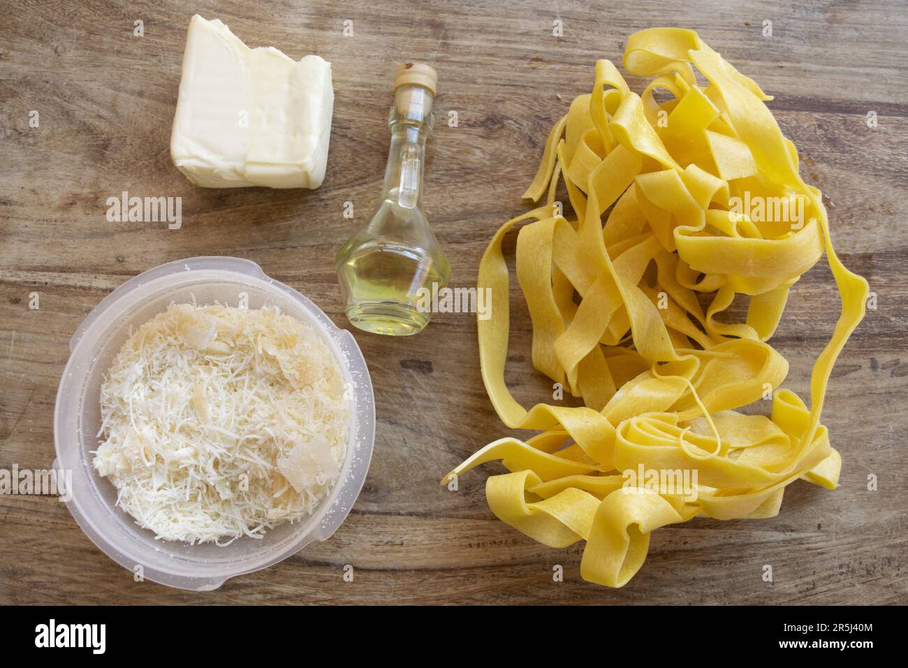 ingredients to making fettuccine Alfredo with butter parmesan cheese