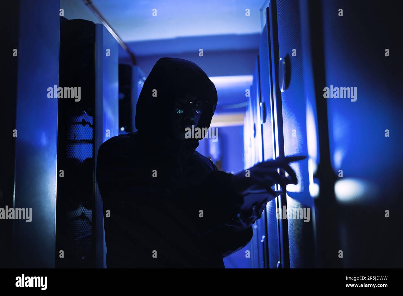 Say goodbye to your private data. a hacker using a digital tablet in a ...