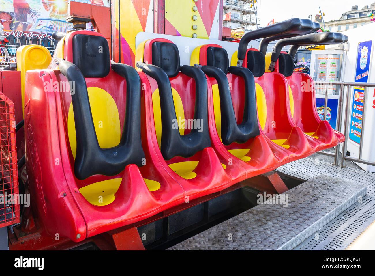Over-the-shoulder restraints on a small drop tower fairground ride. Stock Photo