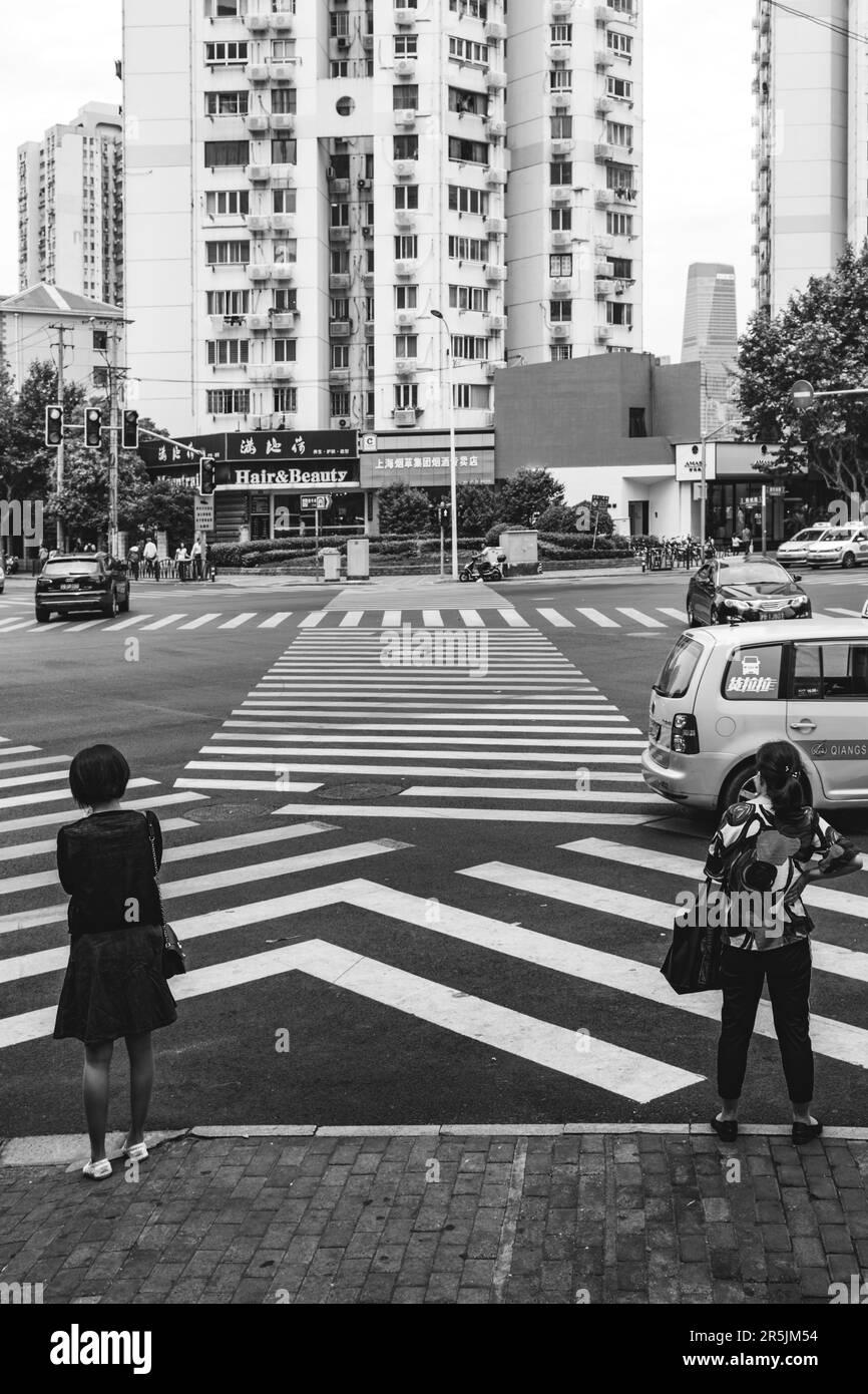 Black and white street crossing in shanghai's suburbs Stock Photo