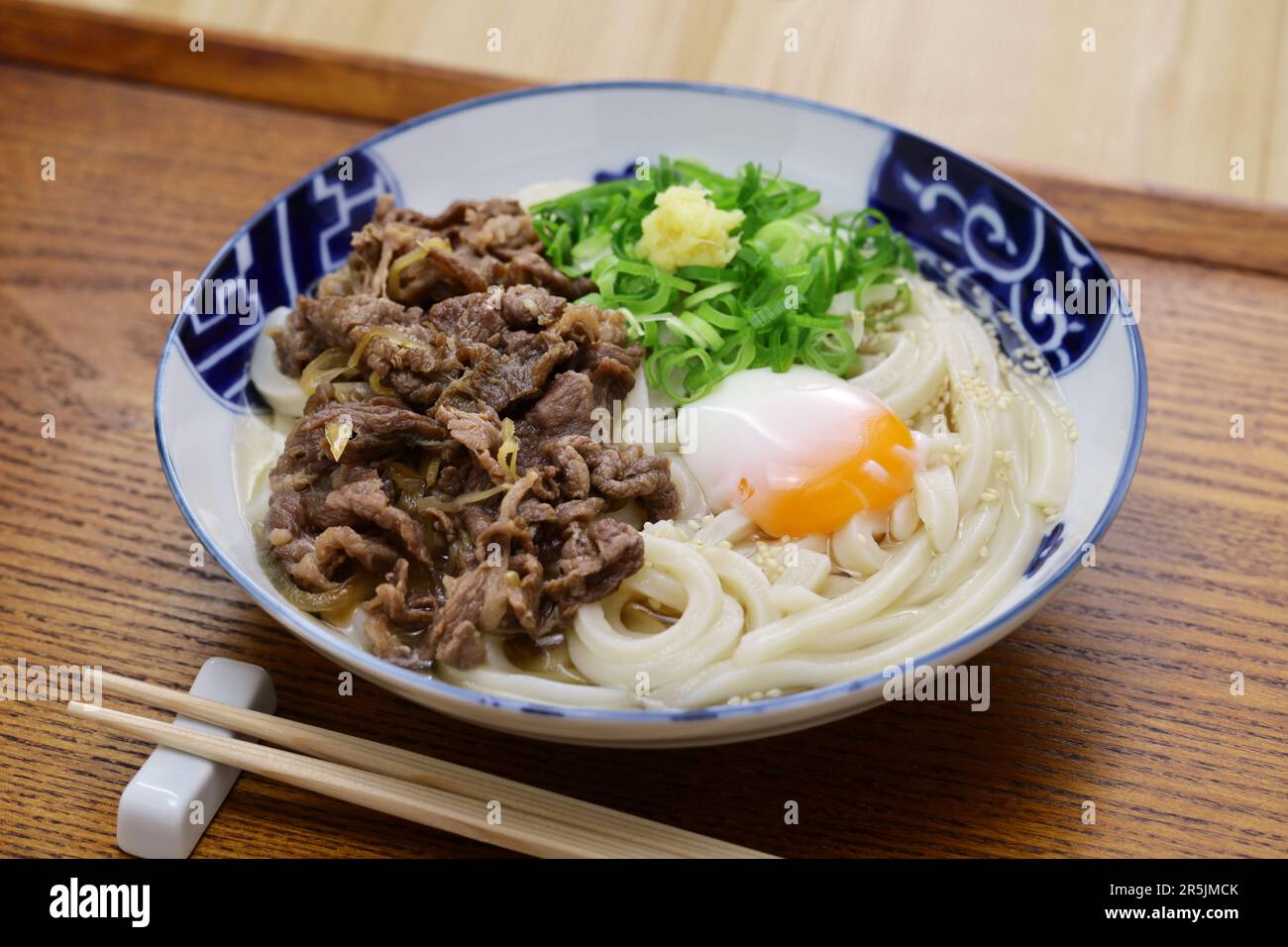 Sanuki udon with beef and softboiled egg, Japanese noodle dish Stock