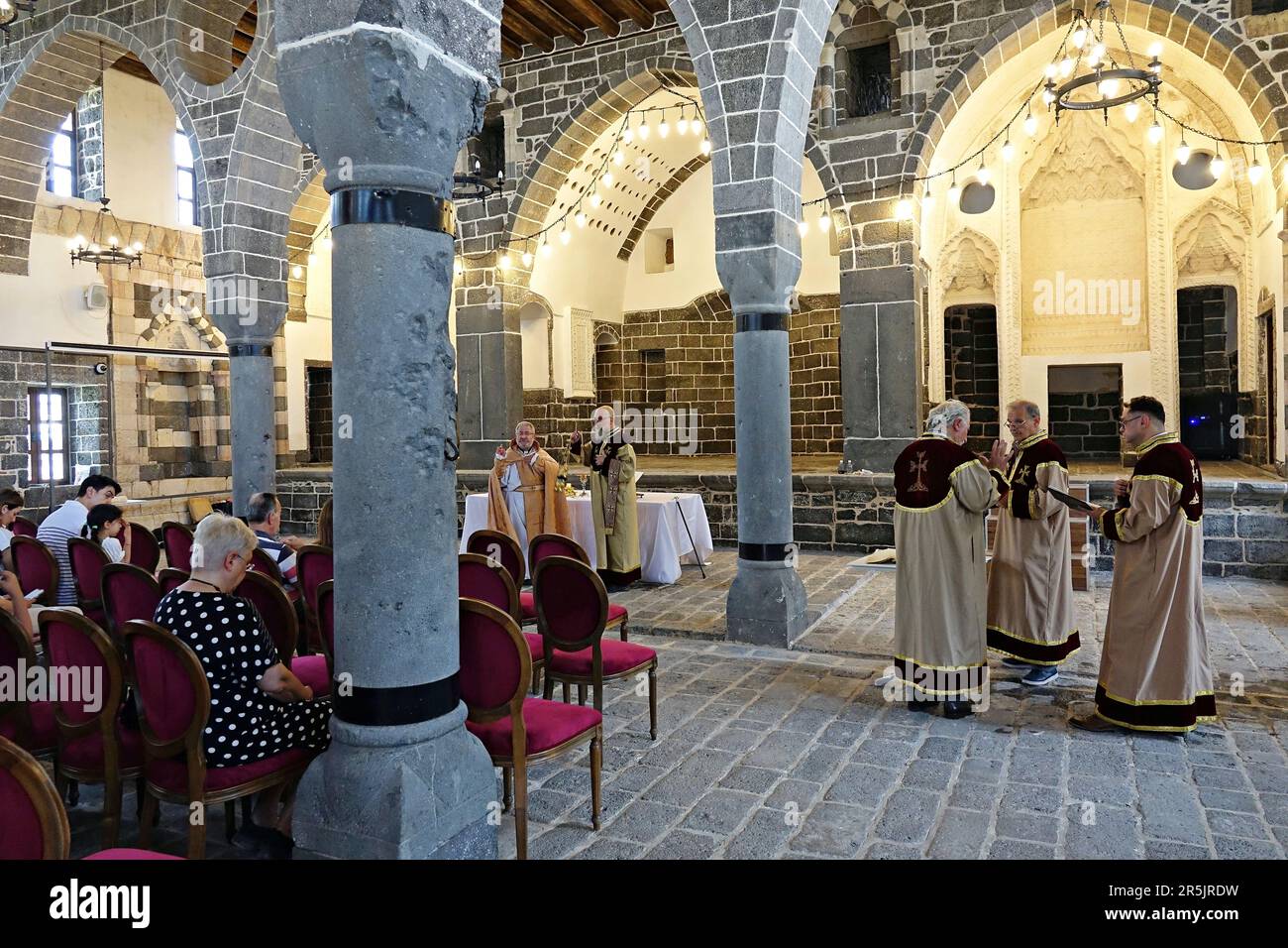 People attend the ritual at Diyarbak?r Surp Hovsep Church. At the Surp Hovsep Armenian Catholic Church, which was heavily damaged in clashes between armed Kurdish PKK militants and Turkish security forces in the center of Diyarbakir in 2015 and repaired as a result of a 4-year restoration, the second ritual in the last 100 years after the first ritual in 2021. Very few Armenians who came from Istanbul and lived in Diyarbakir attended the ceremony. The ritual was led by Senior Priest Abraham Firat and Subordinate Deacon Jan Acemoglu, who were ordained from Istanbul. The church is used today as Stock Photo