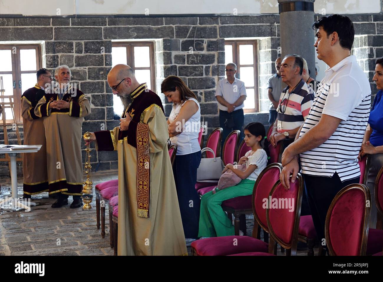 People attend the ritual at Diyarbak?r Surp Hovsep Church. At the Surp Hovsep Armenian Catholic Church, which was heavily damaged in clashes between armed Kurdish PKK militants and Turkish security forces in the center of Diyarbakir in 2015 and repaired as a result of a 4-year restoration, the second ritual in the last 100 years after the first ritual in 2021. Very few Armenians who came from Istanbul and lived in Diyarbakir attended the ceremony. The ritual was led by Senior Priest Abraham Firat and Subordinate Deacon Jan Acemoglu, who were ordained from Istanbul. The church is used today as Stock Photo