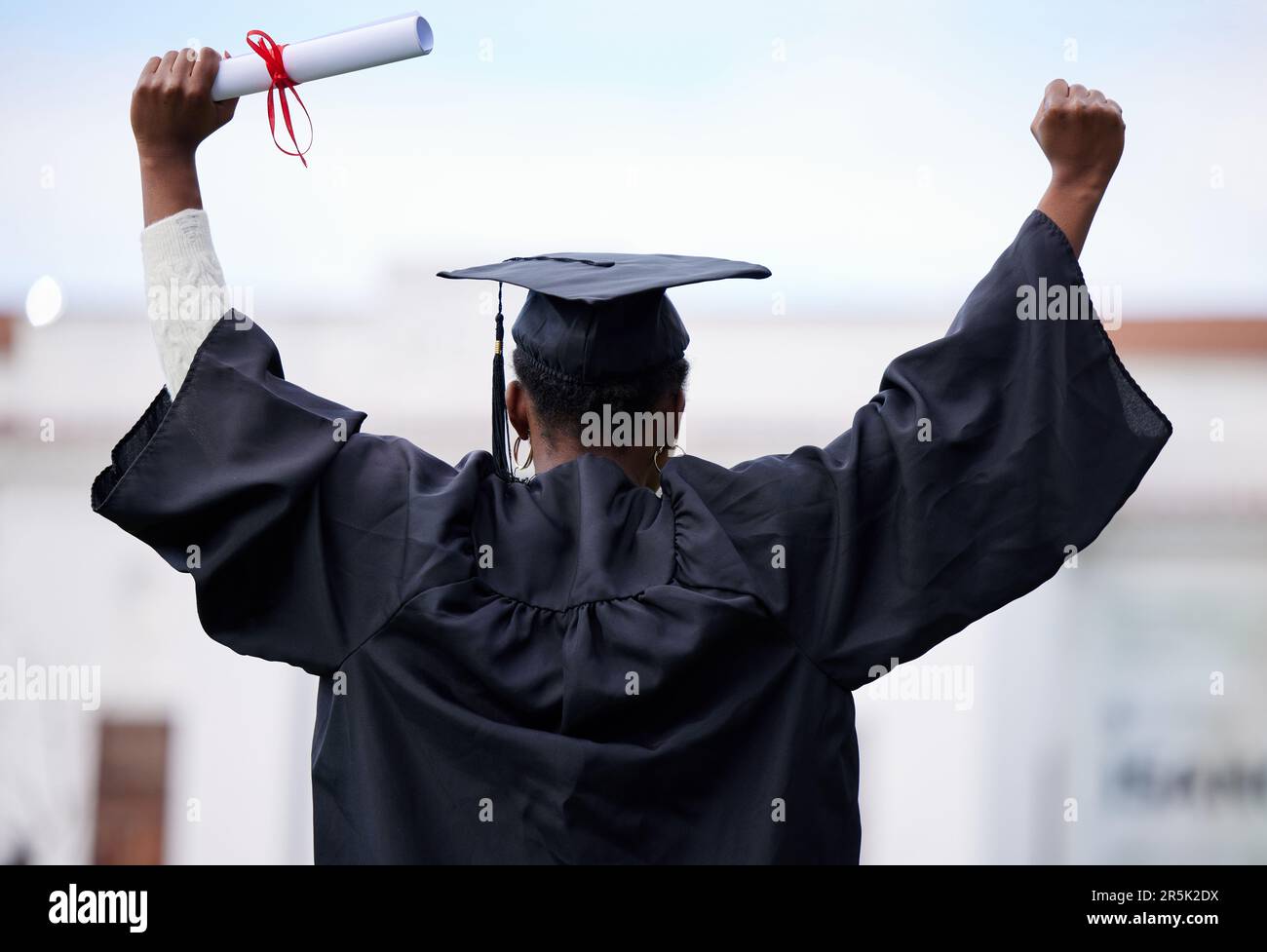 Back, education and black woman with graduation, celebration and success  with a diploma. Female person, graduate and girl with a degree, achievement  Stock Photo - Alamy