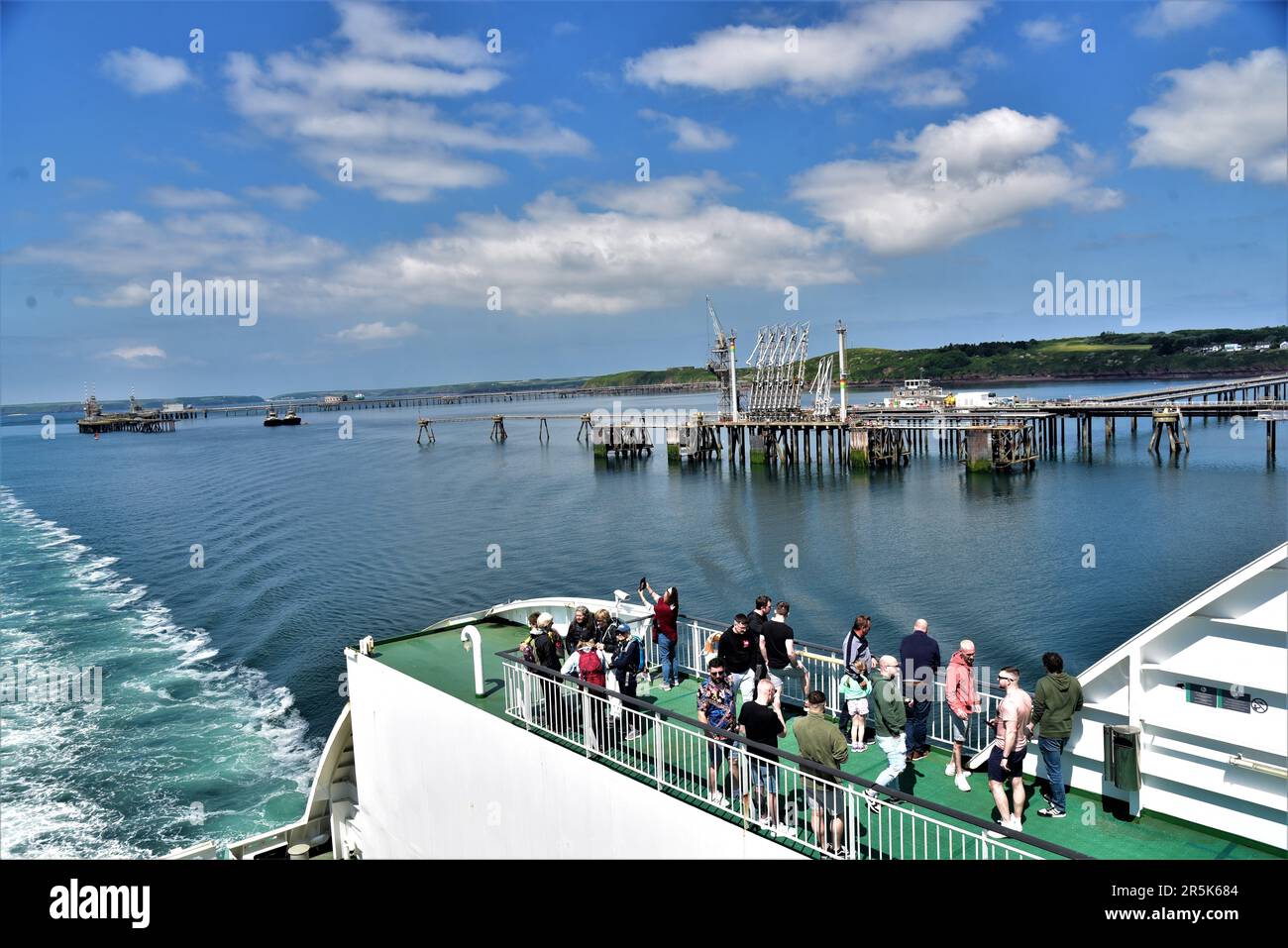 Pictures show approaching Milford Haven waterway and Energy Park heading towards Pembroke Dock .Pictured from the stern of the OSCAR WILDE super ferry Stock Photo