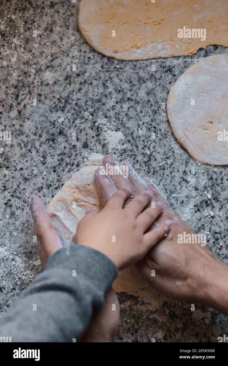 Father and son cooking together Stock Photo