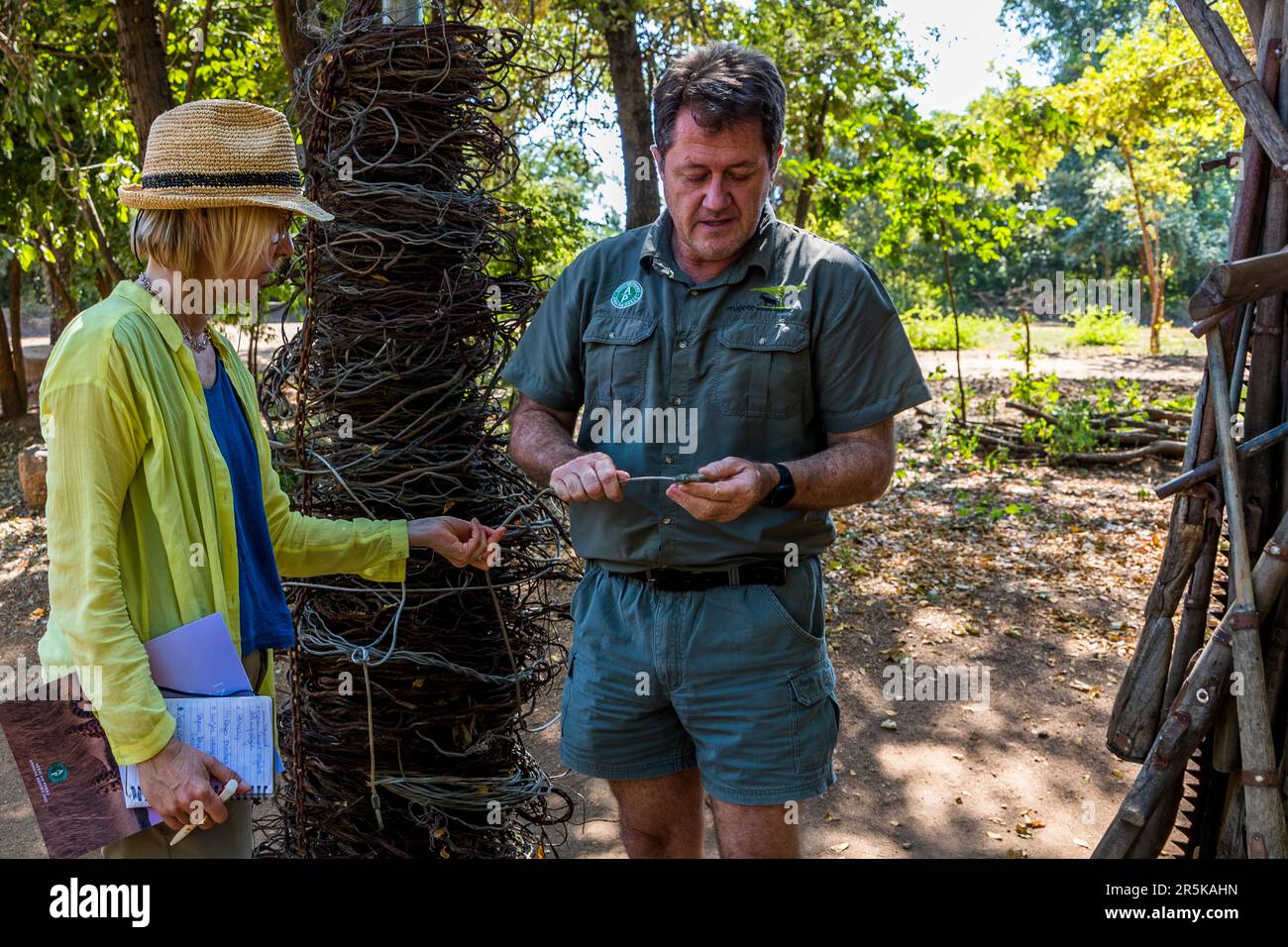 Confiscated weapons and traps used by poachers in the area of Majete National Park, Malawi. Majete Wildlife Reserve, Park Manager John Adendorff shows journalist Angela Berg how poachers lay metal snares Stock Photo