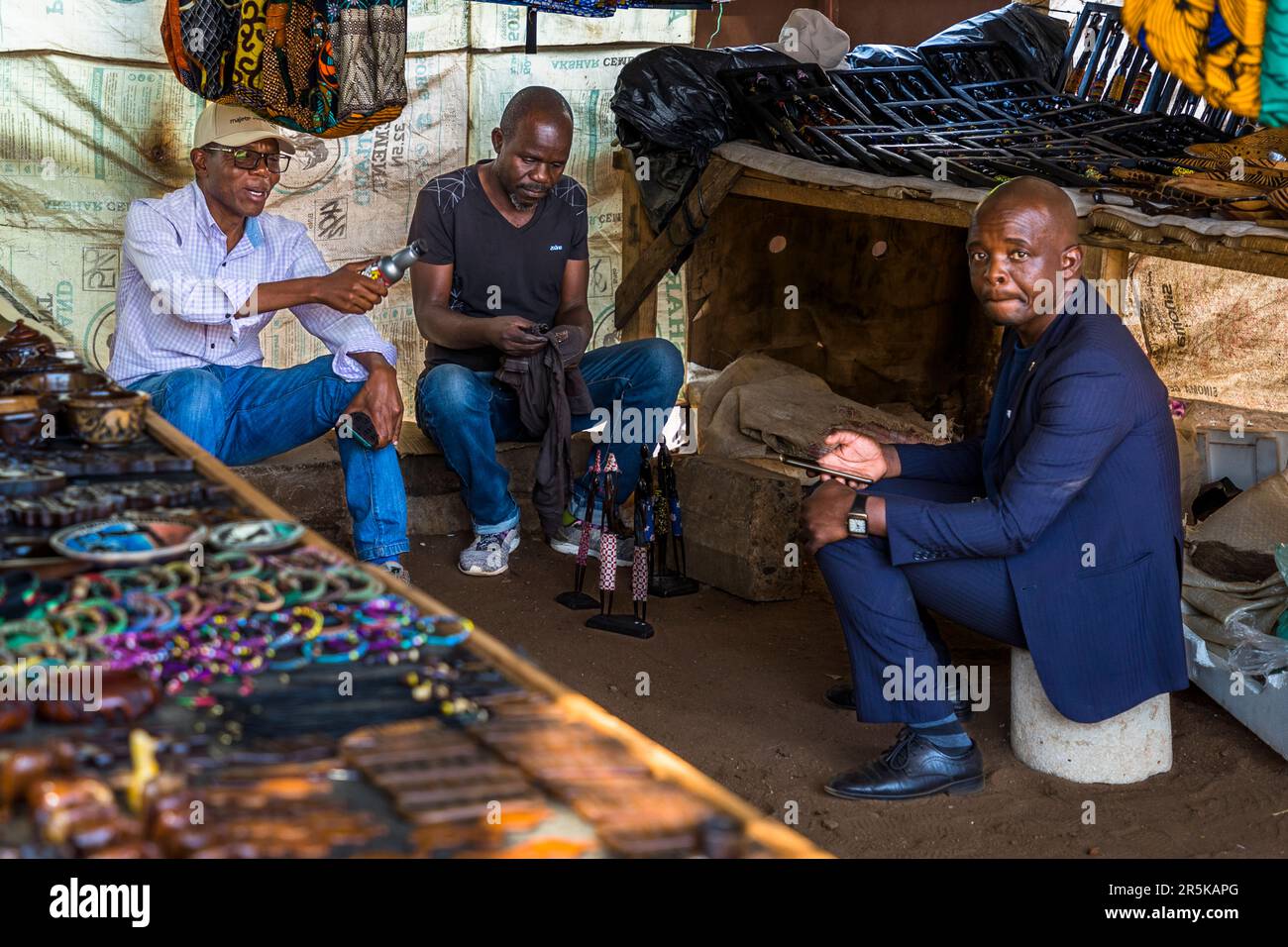 Men in a stall at the Souvenir and Curio Market market in  Lilongwe, Malawi Stock Photo