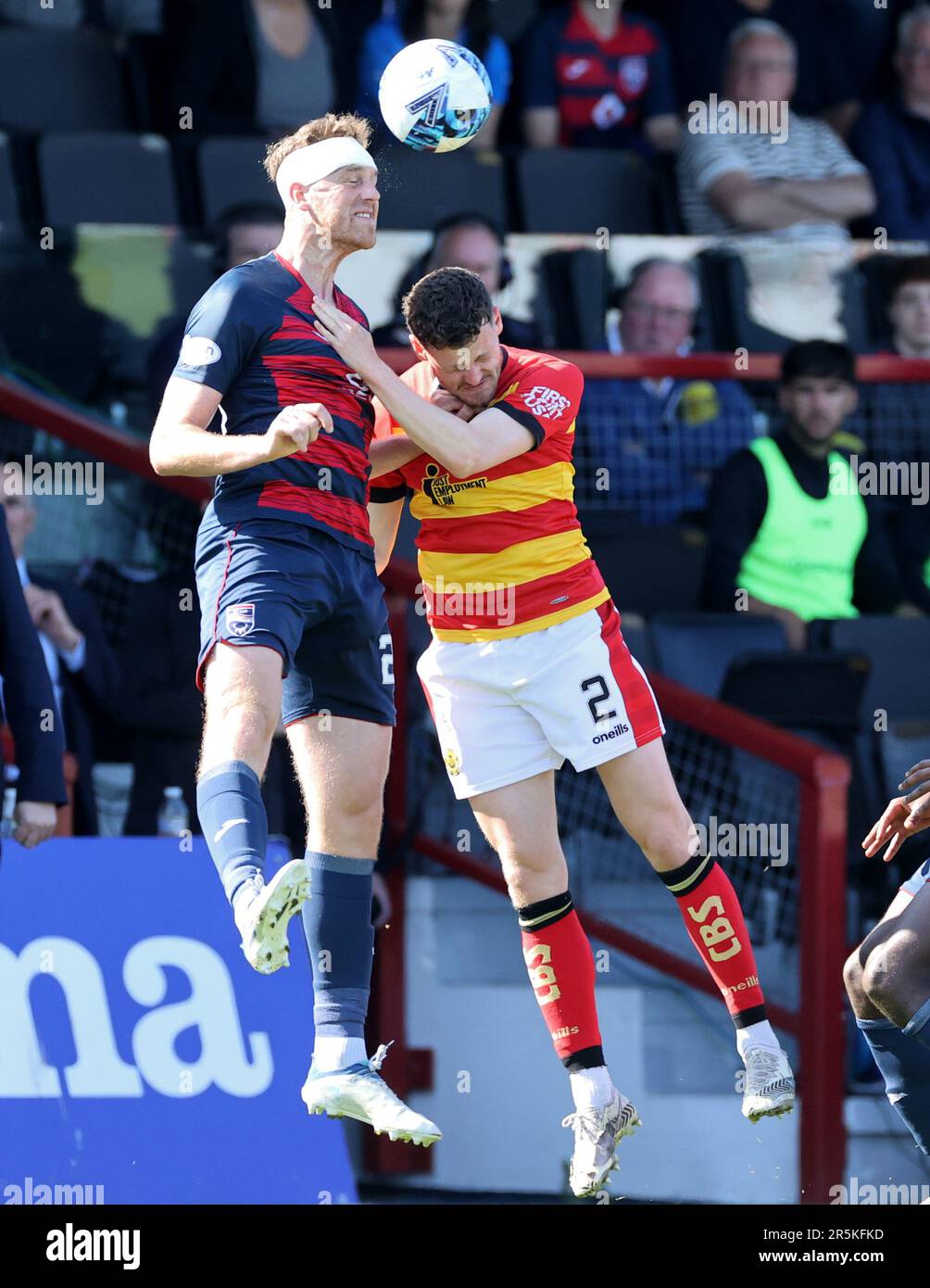 Ross County's Jordan White (left) and Partick Thistle's Jack McMillan battle for the ball during the cinch Premiership second leg play-off final match at the Global Energy Stadium, Dingwall. Picture date: Sunday June 4, 2023. Stock Photo
