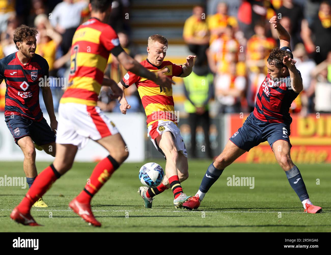 Partick Thistle's Scott Tiffoney and Ross County's Connor Randall battle for the ball during the cinch Premiership second leg play-off final match at the Global Energy Stadium, Dingwall. Picture date: Sunday June 4, 2023. Stock Photo