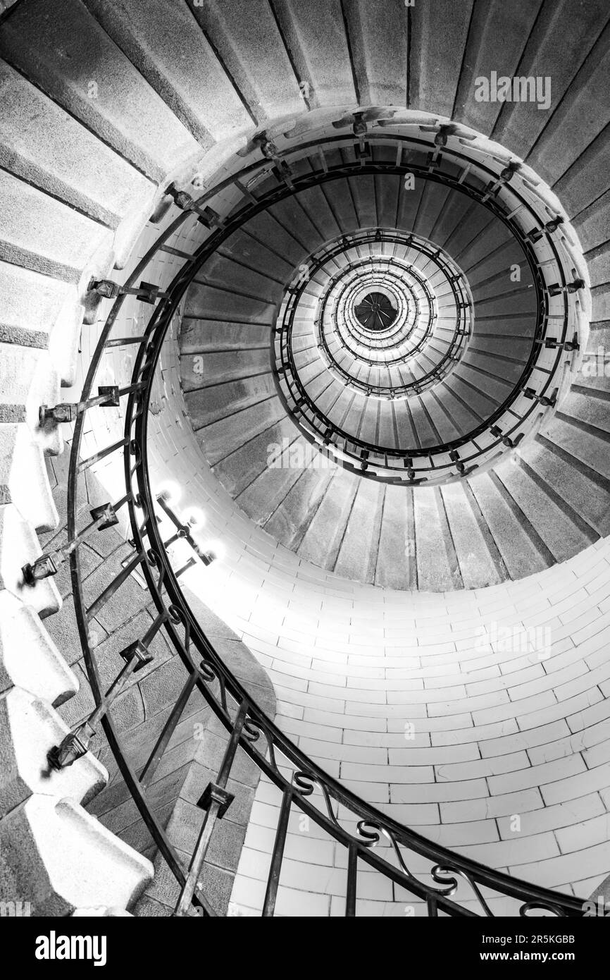 Plouguerneau, France - August, 08 2017 : Black and white vertical real photography of Spiral stairs inside the lighthouse, brittany,france Stock Photo