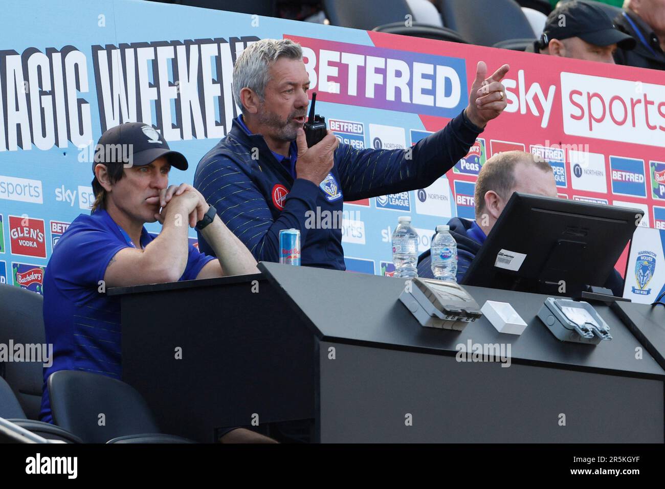 Warrington Wolves Head Coach, Daryl Powell, (centre) radios to the touchline during the Betfred Super League match at St. James' Park, Newcastle upon Tyne. Picture date: Sunday June 4, 2023. Stock Photo