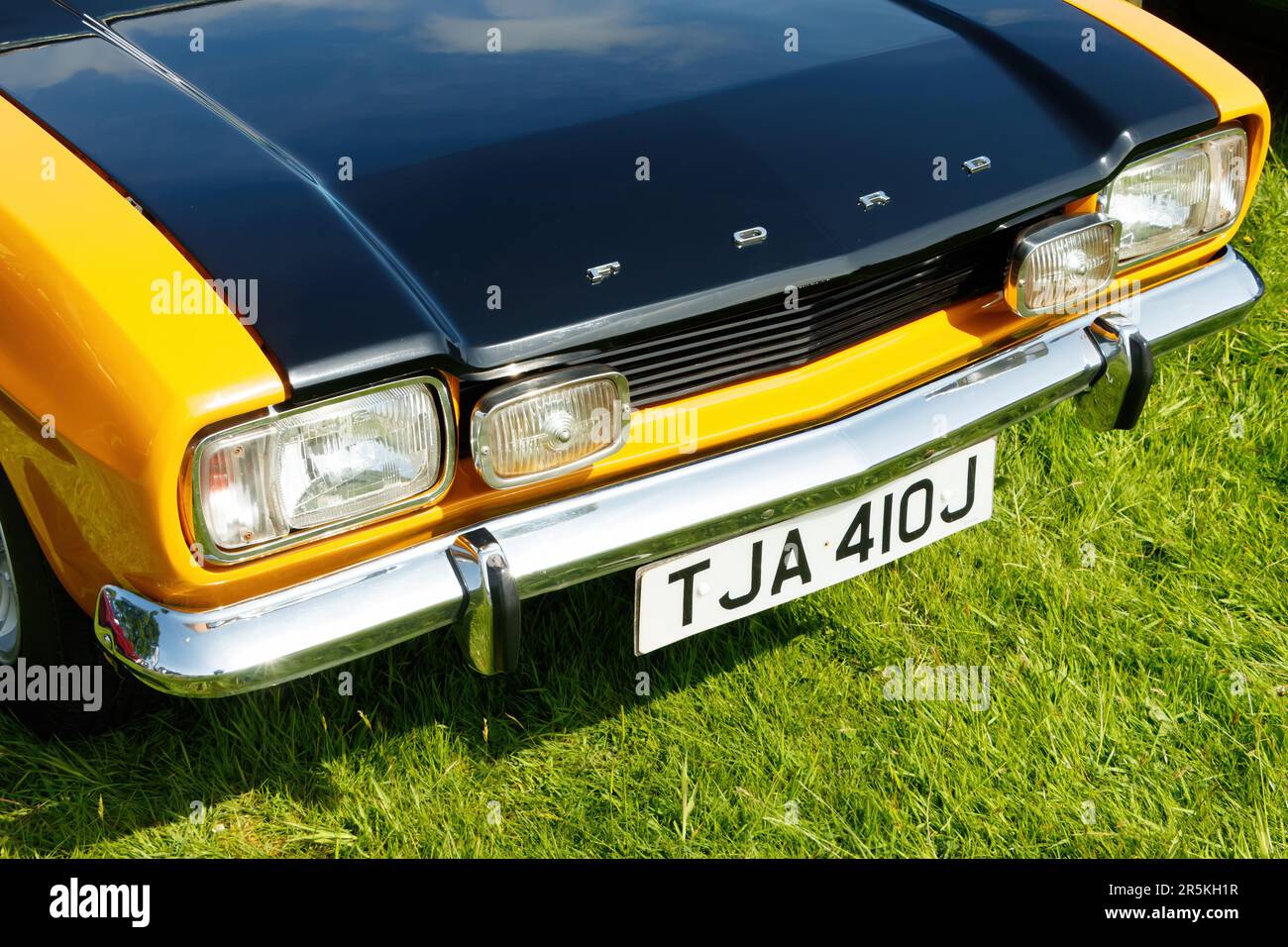 close up of 1970s 1971 Ford Capri yellow and black at vintage classic car show Capesthorne Hall Cheshire UK 2023 Stock Photo