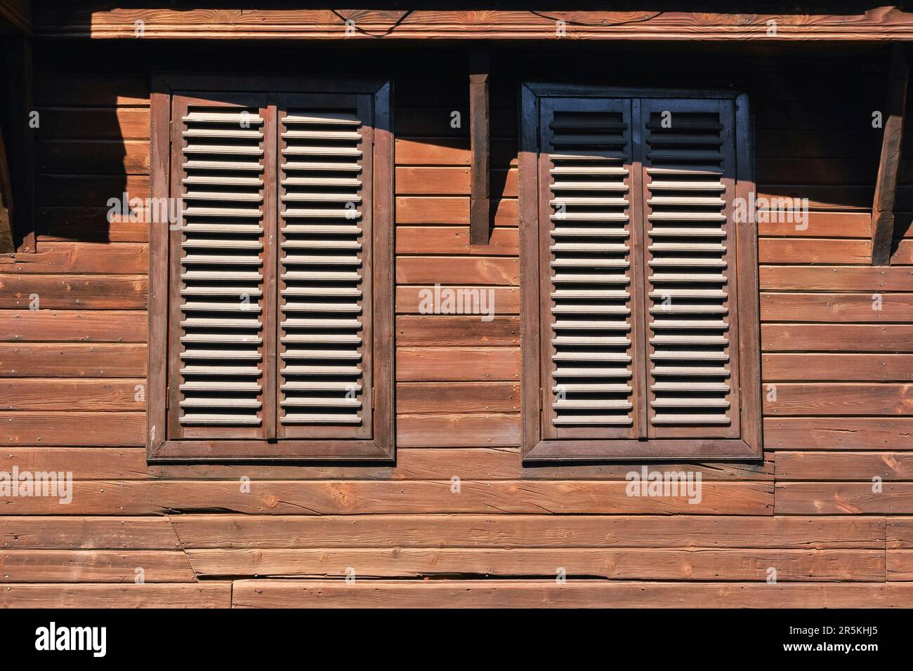 windows on the vintage wooden wall. ancient architecture Stock Photo