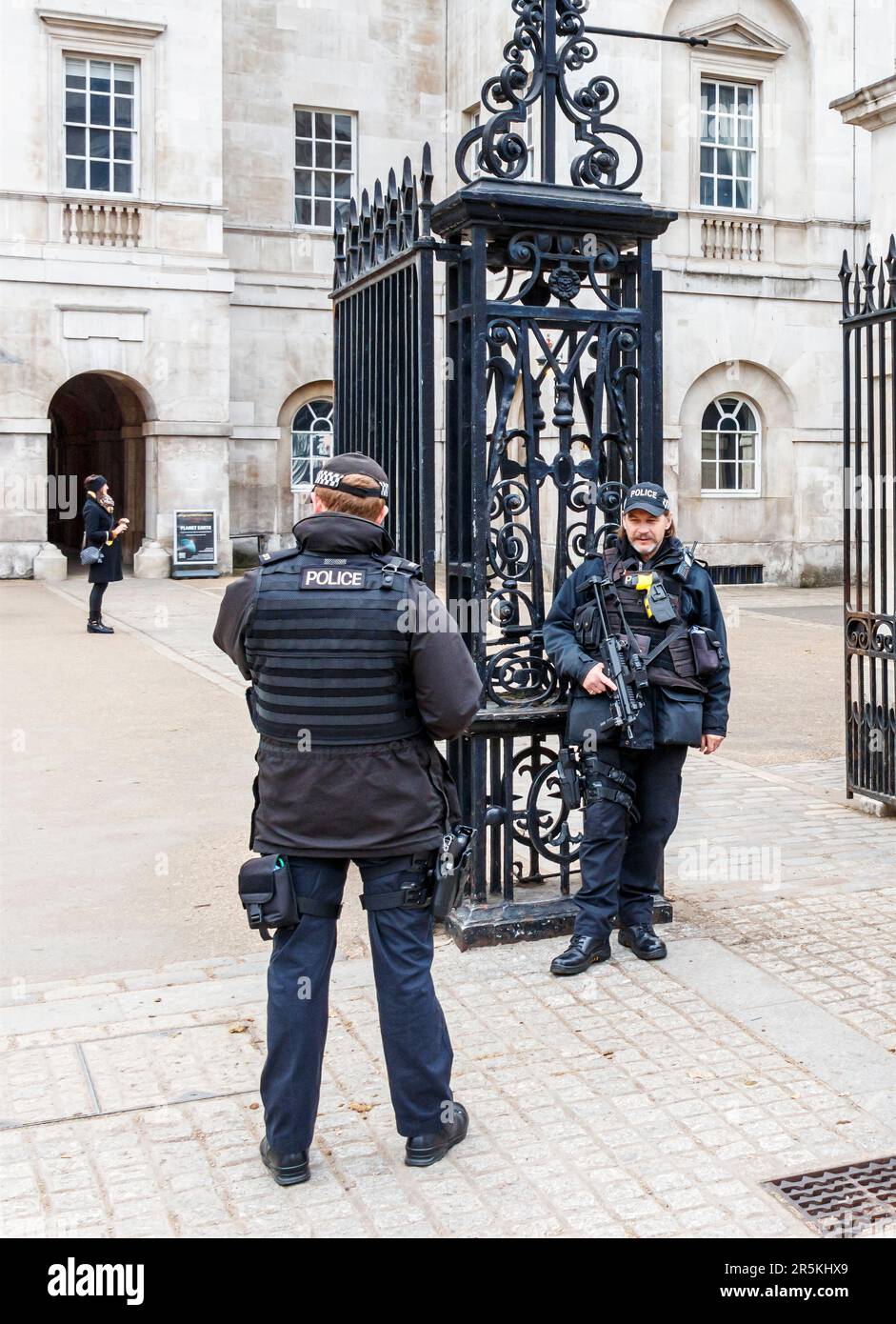 Armed police officers at the gates of Horseguards Parade, Whitehall, London, UK Stock Photo
