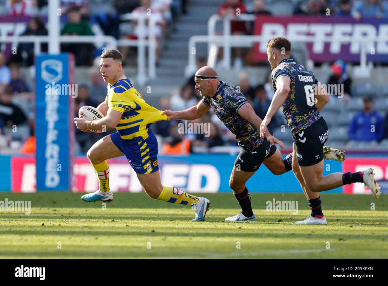Warrington Wolves’ George Williams is tackled during the Betfred Super League match at St. James' Park, Newcastle upon Tyne. Picture date: Sunday June 4, 2023. Stock Photo