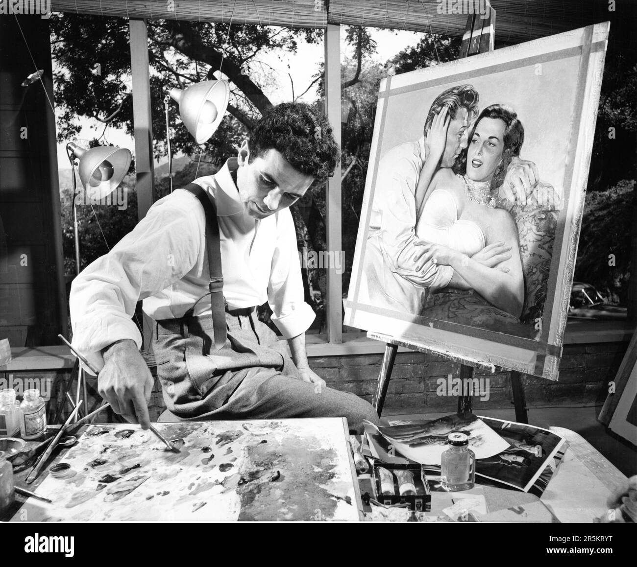 Artist MARIO ARMOND ZAMPARELLI creating the movie poster artwork for ROBERT MITCHUM and JANE RUSSELL in MACAO 1952 director JOSEF von STERNBERG executive producer Howard Hughes RKO Radio Pictures Stock Photo
