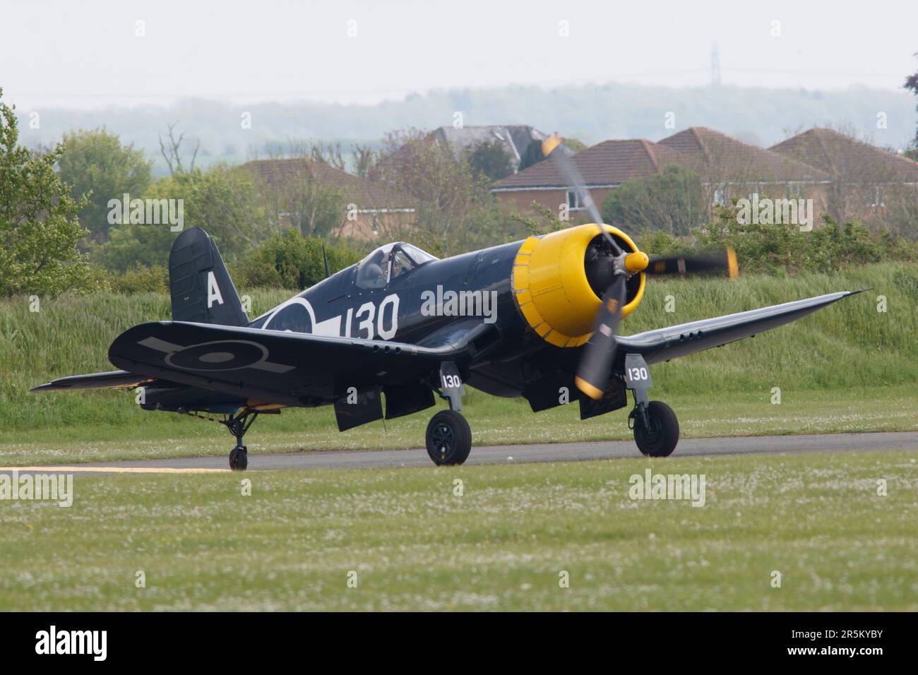 A Corsair taking off for a flying display at RAF Duxford in Cambridgeshire England, 2023 Stock Photo