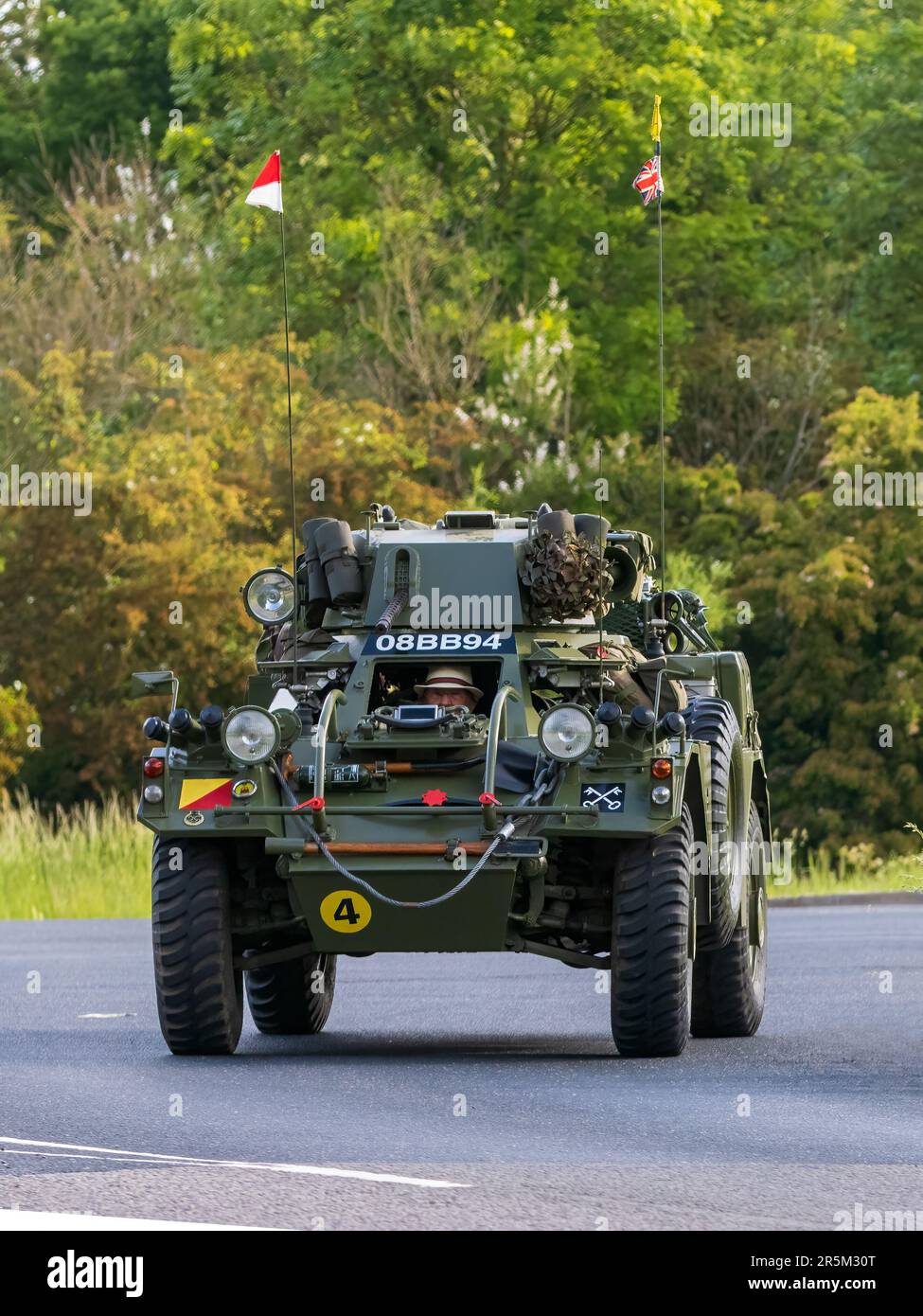 Stony Stratford,UK - June 4th 2023: 1958 ex army Daimler Ferret Scout Car travelling on an English country road. Stock Photo