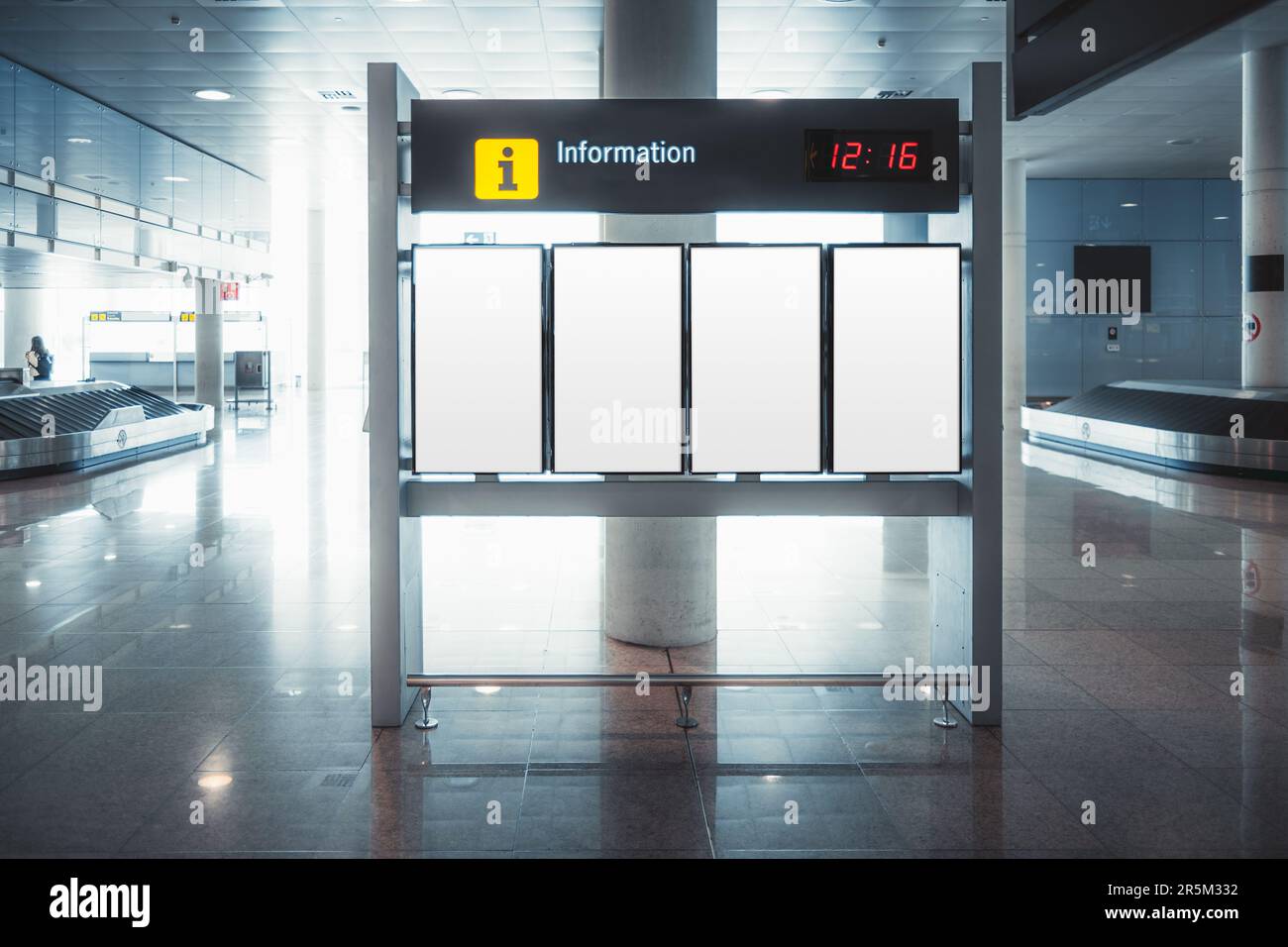Empty flight information mock-up boards in Barcelona airport. Standing against a column, bathed in bright white light, awaiting passengers' attention Stock Photo
