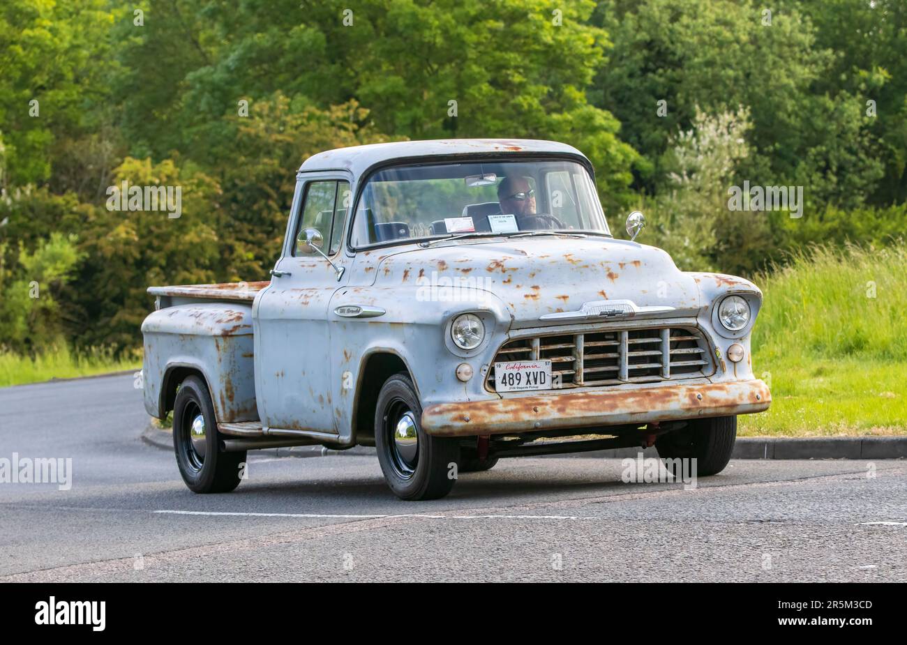 Stony Stratford,UK - June 4th 2023: 1957 old CHEVROLET pick up travelling on an English country road. Stock Photo