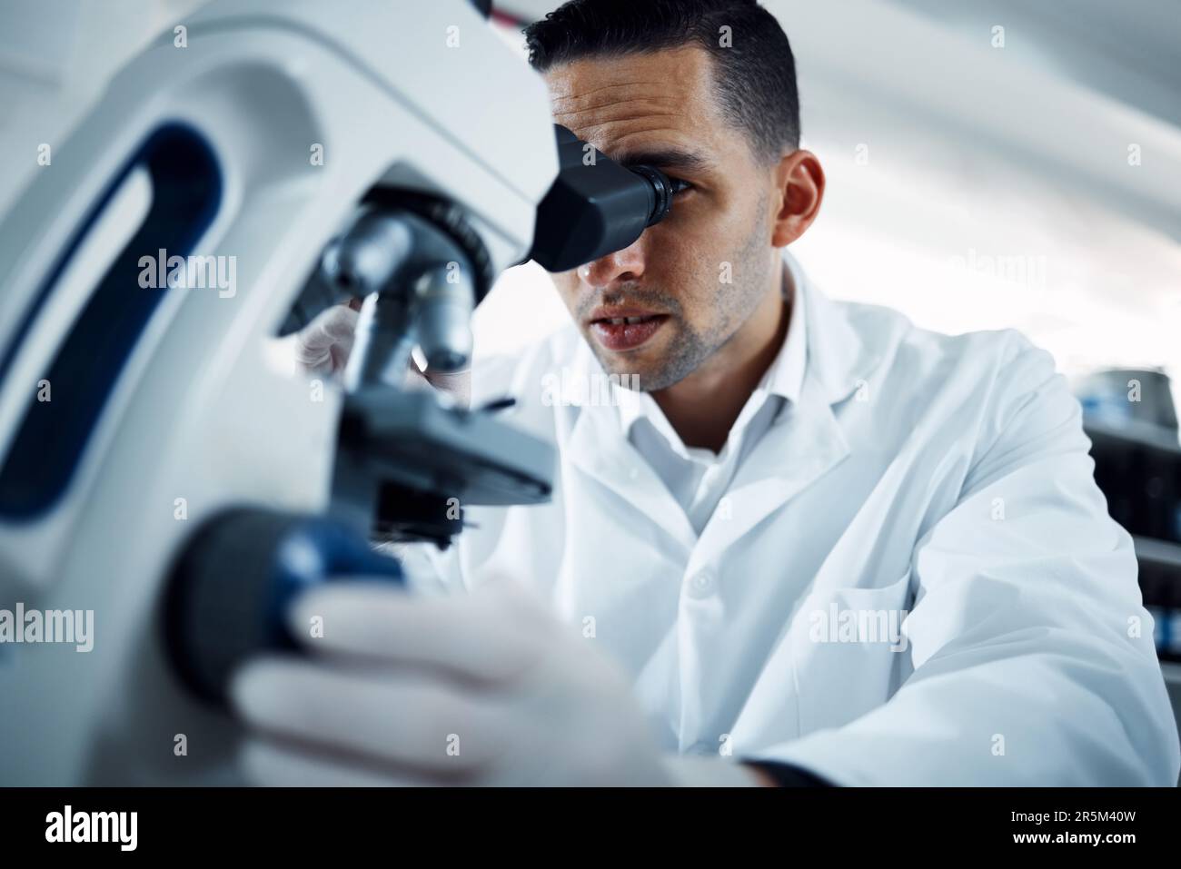Microscope, science and man scientist in a lab for research, medical