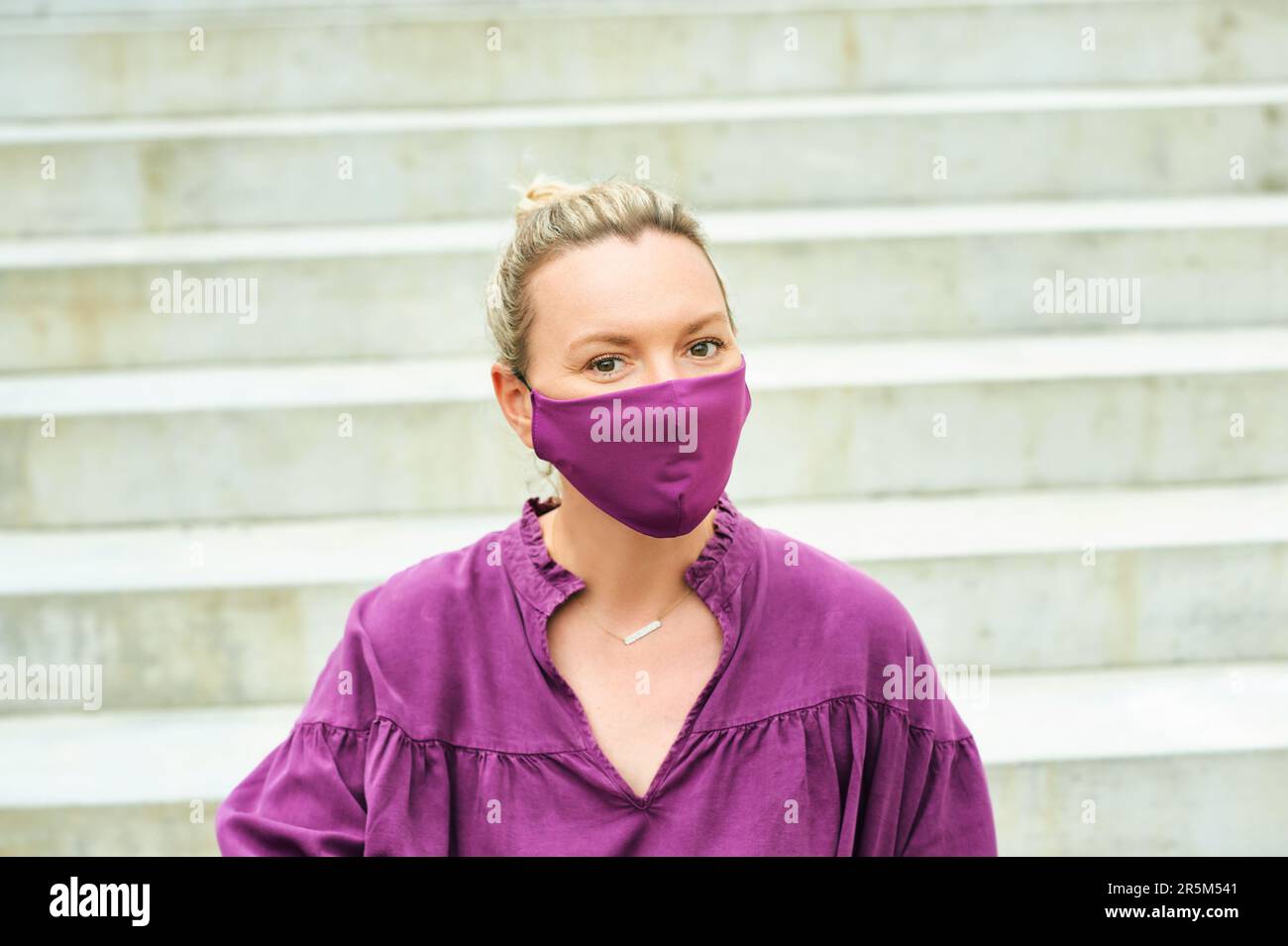 Mature woman wearing facial mask hi-res stock photography and images ...